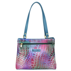 Medium Everyday Tote - 710 from Anuschka, crafted from genuine leather, features a blue tote bag with a multicolor snakeskin pattern and a brand logo on the front.