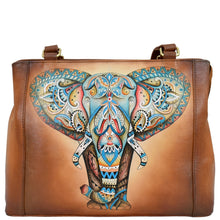 Load image into Gallery viewer, Introducing the Anuschka Medium Everyday Tote - 710, a genuine leather brown tote bag adorned with a vibrant and detailed elephant head design on the front. This stylish tote features two sturdy straps, brass hardware, and multiple pockets to provide ample storage space.
