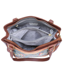 Load image into Gallery viewer, The Anuschka Medium Everyday Tote - 710 is a brown genuine leather tote bag adorned with floral designs. It features two main compartments and a central zippered pocket, all lined with light gray fabric that has a subtle pattern.
