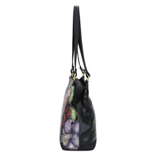 Load image into Gallery viewer, Black Anuschka Medium Everyday Tote - 710 with floral design on the side.
