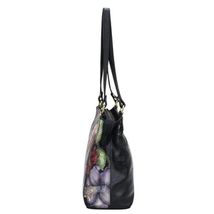 Black Anuschka Medium Everyday Tote - 710 with floral design on the side.