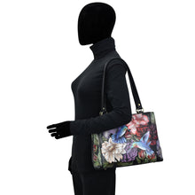 Load image into Gallery viewer, Mannequin displaying a hand-painted, floral Anuschka Medium Everyday Tote - 710.
