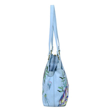 Load image into Gallery viewer, Blue Medium Everyday Tote - 710 with hand-painted floral and bird print design against a white background by Anuschka.
