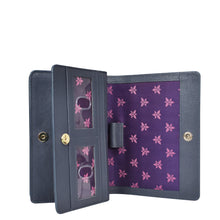 Load image into Gallery viewer, An Anuschka navy blue genuine leather wallet with a floral patterned interior, multiple card slots, and RFID blocking.
