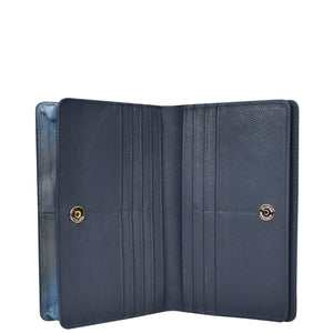 Open navy blue genuine leather 4 in 1 Organizer Crossbody - 711 with multiple card slots and snap fasteners by Anuschka.