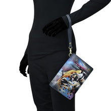 Load image into Gallery viewer, Mannequin dressed in a black bodysuit displaying a Anuschka RFID blocking, genuine leather 4 in 1 Organizer Crossbody - 711 with a tiger design.
