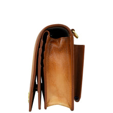 Load image into Gallery viewer, Side view of the Anuschka 4 in 1 Organizer Crossbody - 711 in brown genuine leather, showcasing the compartments and stitching detail. The bag is partially open, featuring a gold-tone metal ring on one side and includes a removable crossbody strap for added versatility.
