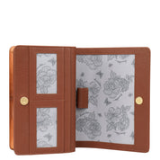 Anuschka's 4 in 1 Organizer Crossbody - 711 is an open brown genuine leather wallet featuring a charming floral and bee pattern lining. It includes slots for cards, offers RFID blocking protection, and has a snap button closure.