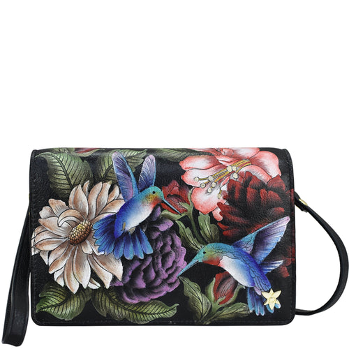 Floral and hummingbird print Anuschka genuine leather wallet with wrist strap.