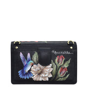 Floral and hummingbird print Anuschka genuine leather wallet with wrist strap.