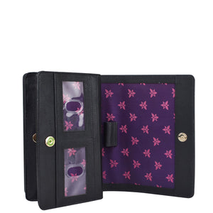 Black leather 4 in 1 Organizer Crossbody - 711 with floral-patterned interior, multiple card slots, and RFID blocking technology by Anuschka.