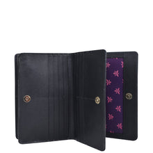 Load image into Gallery viewer, An Anuschka 4 in 1 Organizer Crossbody - 711 unfolded to reveal inner compartments with a purple floral lining.
