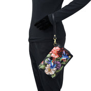 Person in black attire with an Anuschka 4 in 1 Organizer Crossbody - 711 featuring RFID blocking technology.