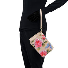 Load image into Gallery viewer, Person in black attire carrying an Anuschka 4 in 1 Organizer Crossbody - 711 with hand-painted artwork.
