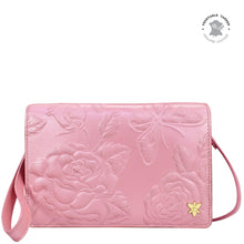 Load image into Gallery viewer, Pink genuine leather 4 in 1 Organizer Crossbody - 711 with floral embossing and a wristlet strap by Anuschka.
