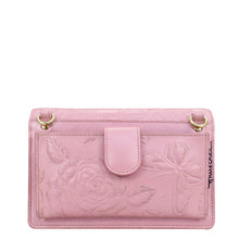 Load image into Gallery viewer, Pink genuine leather 4 in 1 Organizer Crossbody - 711 with floral embossing and a wristlet strap by Anuschka.
