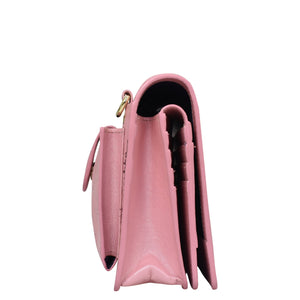 Side view of a pink Anuschka 4 in 1 Organizer Crossbody - 711 with a visible inner compartment and RFID blocking.