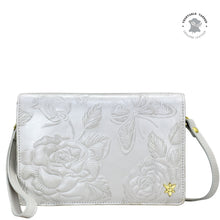 Load image into Gallery viewer, Anuschka 4 in 1 Organizer Crossbody - 711 genuine leather floral-embossed bag with shoulder strap and a decorative butterfly charm.
