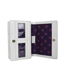 Load image into Gallery viewer, White Anuschka photo album with transparent pockets displaying photographs, featuring a floral purple interior design and crafted from genuine leather.
