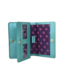 Load image into Gallery viewer, Anuschka&#39;s Turquoise and purple floral-patterned genuine leather 4 in 1 Organizer Crossbody - 711 with card slots.
