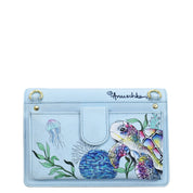 Light blue genuine leather handbag with sea turtle and jellyfish illustration - Anuschka 4 in 1 Organizer Crossbody - 711.