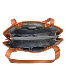 Load image into Gallery viewer, Top view of an open Anuschka Expandable Shopper Tote - 712, showcasing multiple compartments, including a central zippered pocket, side pockets, floral-patterned lining, and snap button closures. This spacious genuine leather handbag is perfect for organization.
