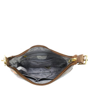 The Anuschka Slim Shoulder Hobo - 714, made of brown genuine leather with gold hardware, is open to show off its interior lined with patterned fabric. This everyday handbag includes several pockets and a zipper for organized storage.