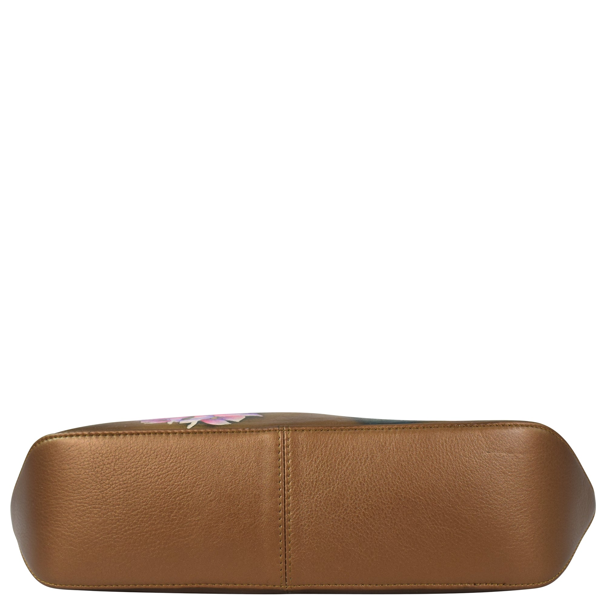 Bottom view of the Slim Shoulder Hobo - 714 by Anuschka, a light brown bag made from genuine leather, featuring a slightly textured surface and a central seam.