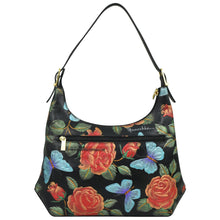 Load image into Gallery viewer, The Anuschka Slim Shoulder Hobo - 714 is a modern Hobo bag crafted from genuine black leather, adorned with a floral pattern of red roses and blue butterflies. It features an adjustable strap and a front zip pocket for added convenience.
