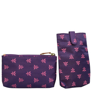 Two purple floral-patterned bags, one with a zip and the other a Anuschka Classic Work Tote - 664 style, isolated on a white background.
