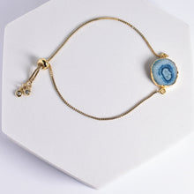 Load image into Gallery viewer, Vanya Lara&#39;s Sliced Quartz Bracelet - VBR0004 with a blue geode slice charm and decorative beads.
