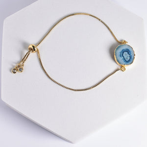 Vanya Lara's Sliced Quartz Bracelet - VBR0004 with a blue geode slice charm and decorative beads.