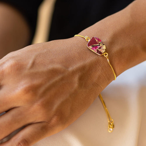 A Mojave Glory Bracelet - VBR0005 by Vanya Lara with a large pink gemstone worn on a woman's wrist.