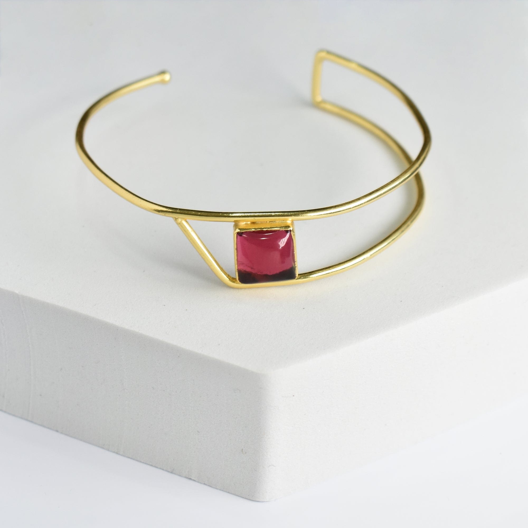 Golden Ratio Bracelet by Vanya Lara, featuring a single red natural gemstone centerpiece.