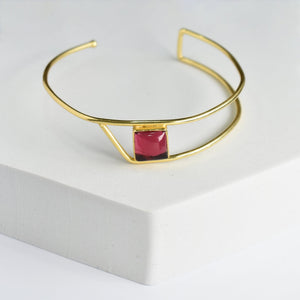 Golden Ratio Bracelet by Vanya Lara, featuring a single red natural gemstone centerpiece.