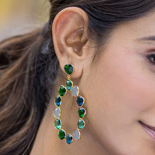A woman wearing a Vanya Lara Kaleidoscope Eternity Earrings - VER0001.