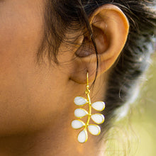 Load image into Gallery viewer, Close-up of a woman&#39;s ear wearing a Foliage Earrings - VER0005 by Vanya Lara, featuring an eye-catching hydro quartz floral design.
