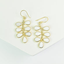 Load image into Gallery viewer, A pair of Foliage Earrings - VER0005 by Vanya Lara, featuring gold-plated and white teardrop-shaped dangle earrings with a unique design, displayed against a white background.
