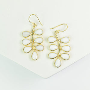 A pair of Foliage Earrings - VER0005 by Vanya Lara, featuring gold-plated and white teardrop-shaped dangle earrings with a unique design, displayed against a white background.