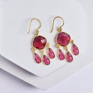 Triple Dew Drop earrings with pink gemstones from Vanya Lara on a white background.