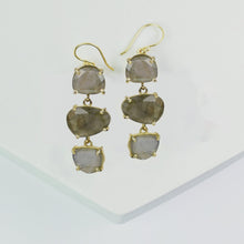 Load image into Gallery viewer, A pair of Vanya Lara Long Triple Drop Earrings with faceted grey natural stones on a white background.
