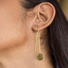 Load image into Gallery viewer, A close-up of a woman&#39;s ear wearing a Vanya Lara Pendulum Thread Earrings - VER0013 with adjustable dimensions and a green gemstone.
