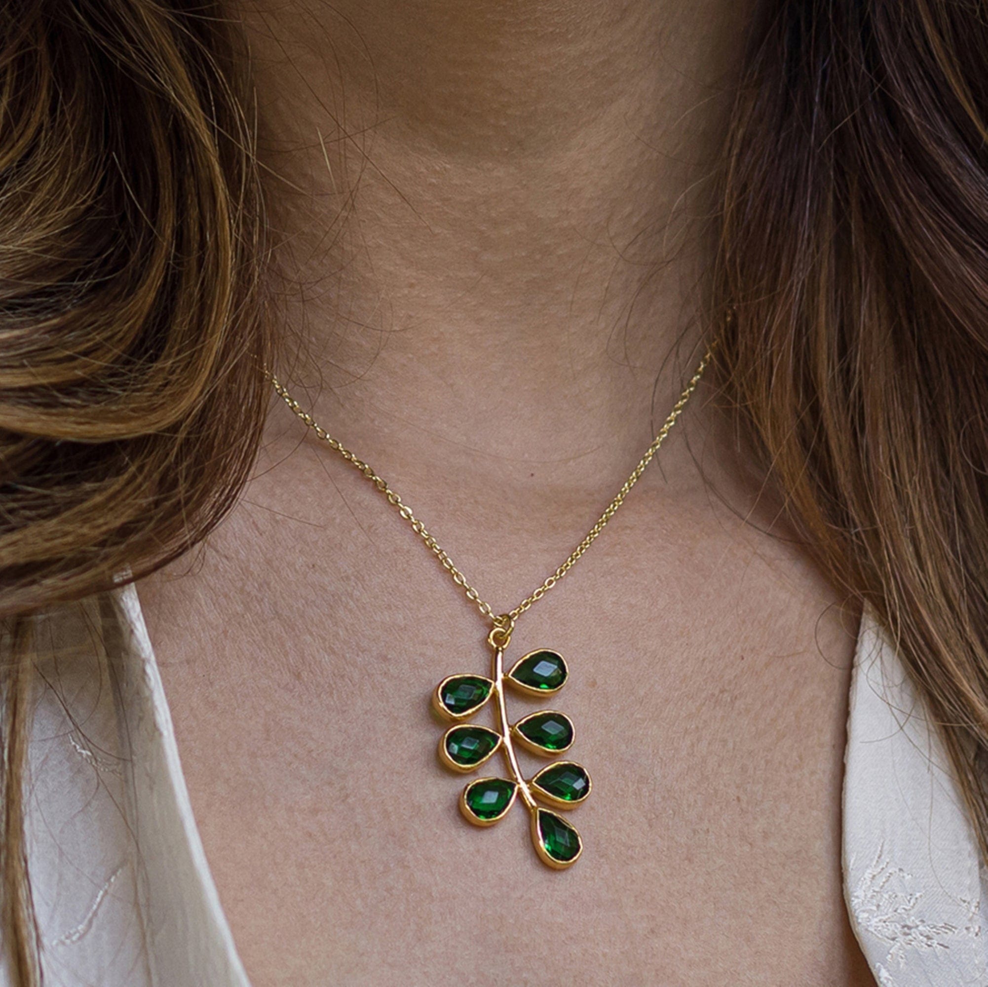 Foliage Necklace - VNK0004 by Vanya Lara, with hydro quartz, leaf-shaped pendant adorning a person's neck.