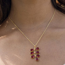 Load image into Gallery viewer, Woman wearing a Vanya Lara foliage necklace with a red hydro quartz pendant.
