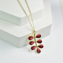 Load image into Gallery viewer, Foliage Necklace by Vanya Lara with a leaf-shaped pendant featuring red hydro quartz gemstones on a white background.
