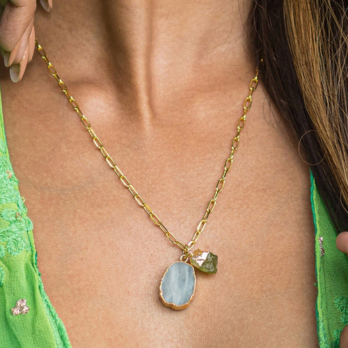 Close-up of a woman wearing a Vanya Lara gold-plated necklace with an Abstract Gemstone Pendant (VNK0005), symbolizing self-love.