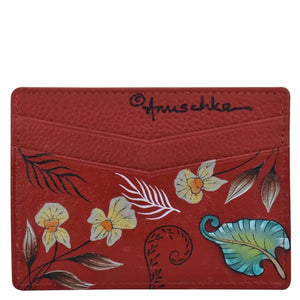 Red floral-patterned leather credit card case with Anuschka designer signature.