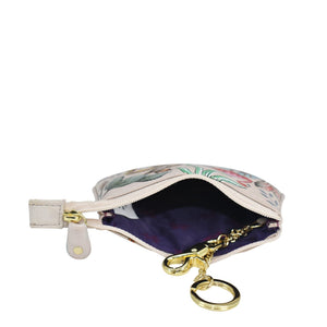 A floral patterned Anuschka Medium Zip Pouch - 1107 with an open zipper and a keyring attached.
