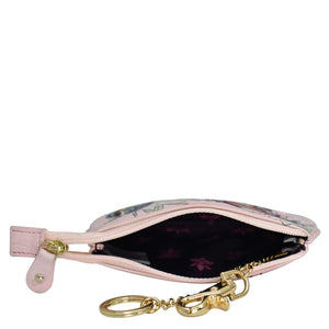 Open Anuschka medium zip pouch - 1107 with a gold-colored keyring.