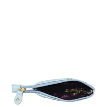 Load image into Gallery viewer, A small, Anuschka genuine leather open white wristlet with a floral interior pattern and a golden zipper visible.
